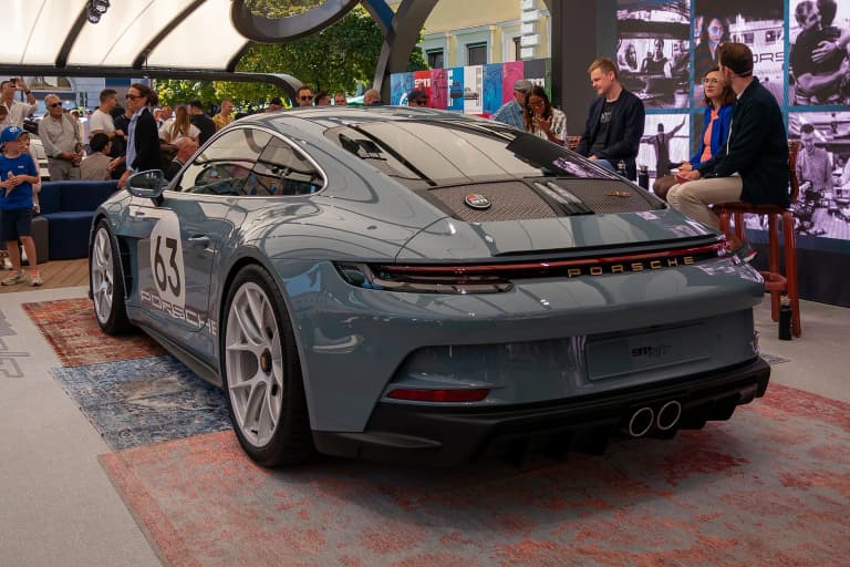 Rear of a grey Porsche 911 S/T (992) on display at IAA 2023 in Munich.