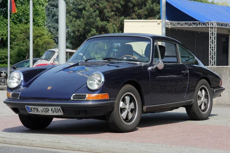Dark blue Porsche 912 coupe parked front three-quarter