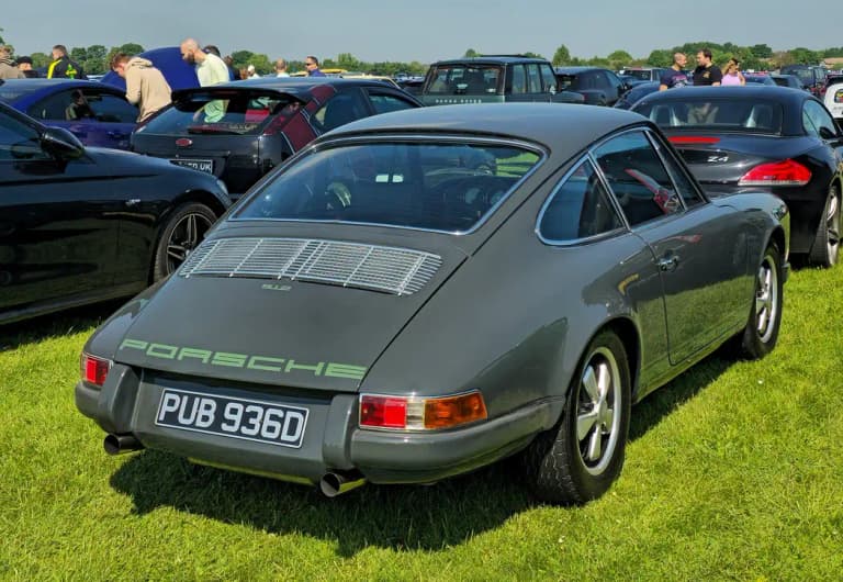 Grey Porsche 912 coupe rear view on grass