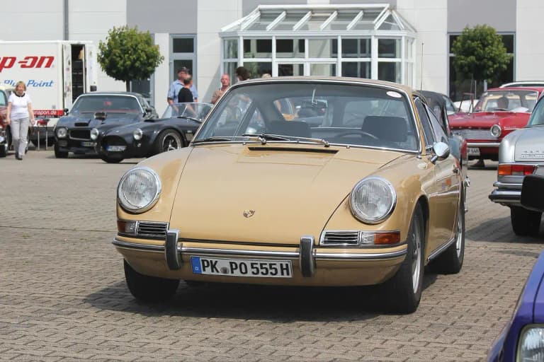 Beige Porsche 912 coupe front three-quarter view at a classic car meet