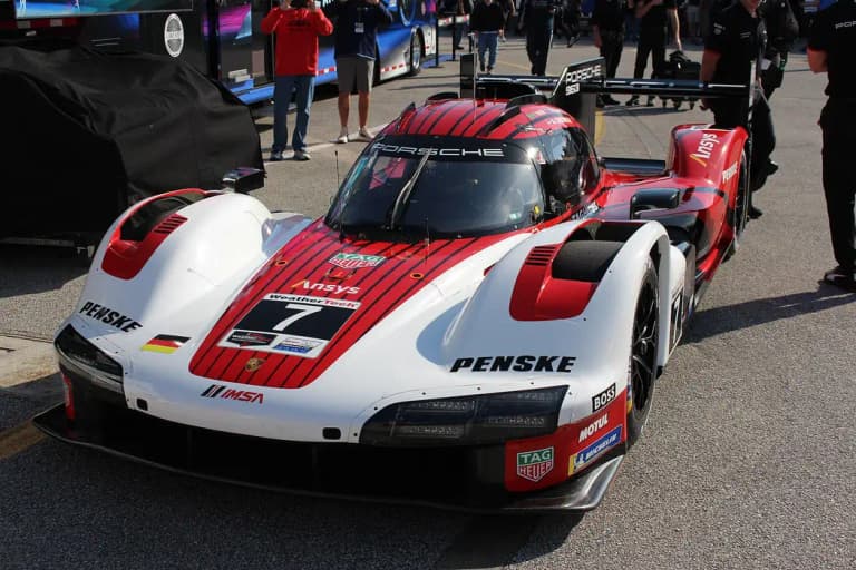 Number 7 Porsche 963 in white and red Penske livery in the pit lane at Daytona