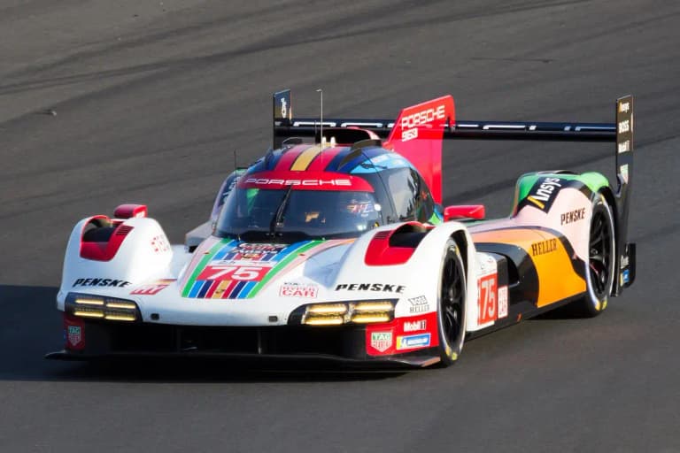 Number 75 Porsche 963 in a special multicolor Penske livery cornering on track