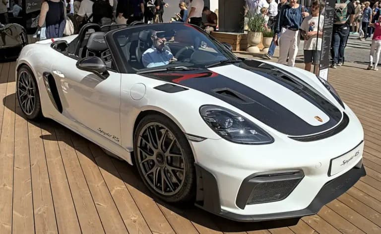 White Porsche 718 Boxster Spyder RS with a carbon fiber hood and the top removed