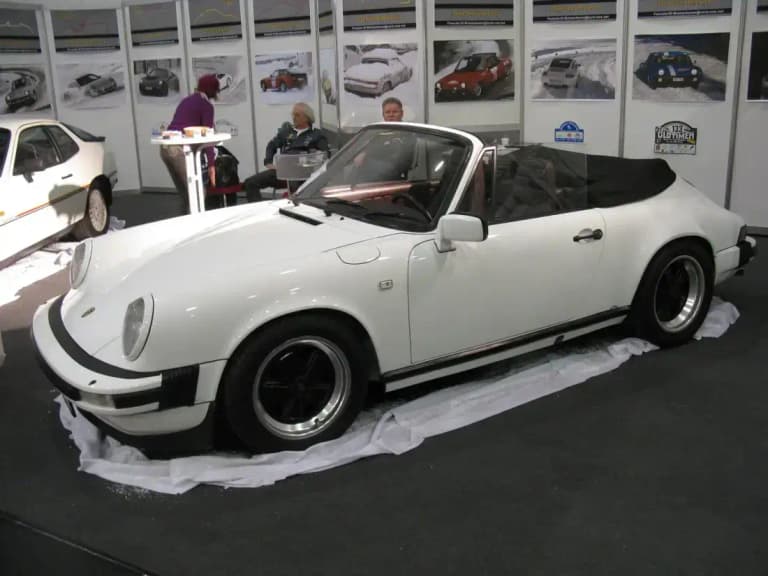 White air-cooled Porsche 911 SC Cabriolet with the soft top raised