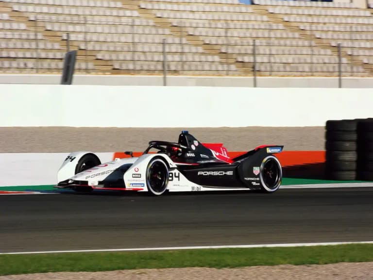 Porsche 99X Electric Formula E race car cornering on track during testing