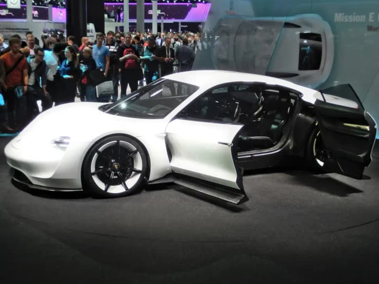 White Porsche Mission E concept car with open suicide doors at the 2015 Frankfurt motor show
