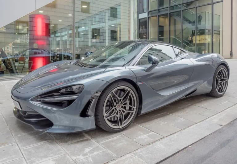 Grey McLaren 720S parked on a city street
