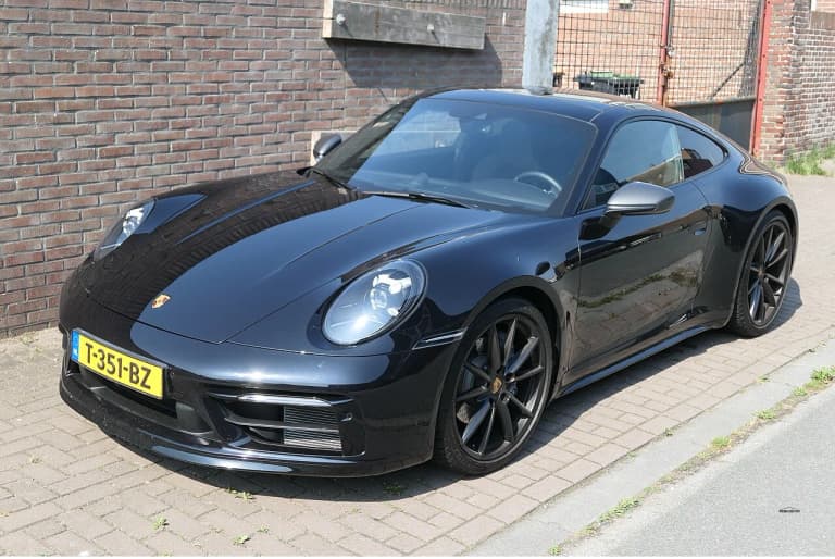 Black Porsche 992 Carrera T front three-quarter view