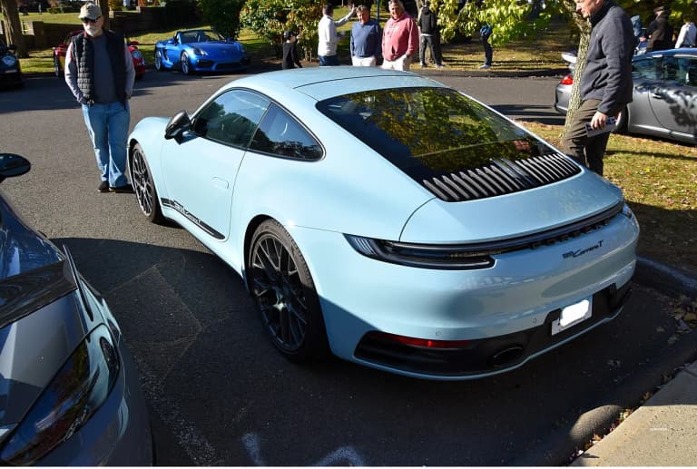Ice Blue Metallic Porsche 992 Carrera T rear three-quarter view