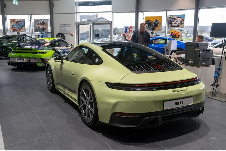 Silver Porsche 992 Carrera T rear three-quarter view