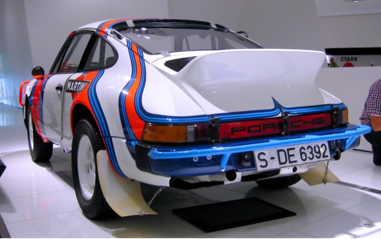 Porsche 911 SC Safari showing raised suspension and rally lights