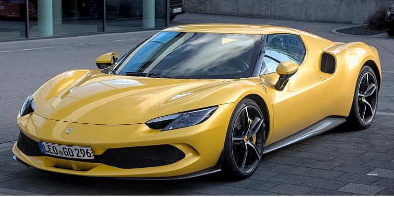 Yellow Ferrari 296 GTB front three quarter view
