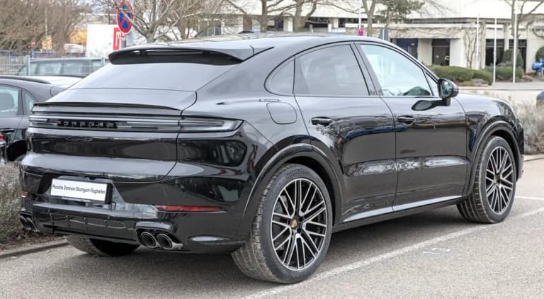 Black Porsche Cayenne Coupe, rear three-quarter view