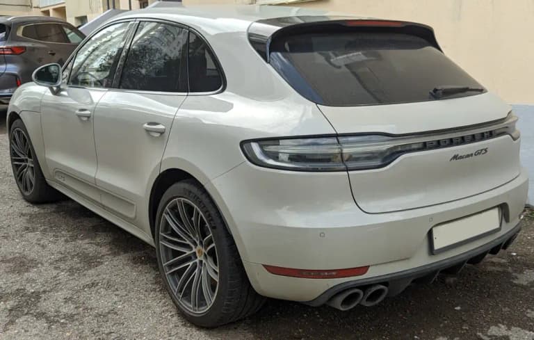 White Porsche Macan GTS, rear three-quarter view