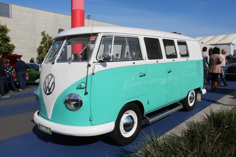 Turquoise and white classic Volkswagen Type 2 Bus at a car show