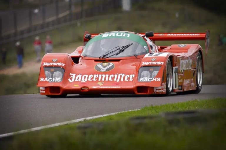 Red Jägermeister Brun Motorsport Porsche 962C racing on track