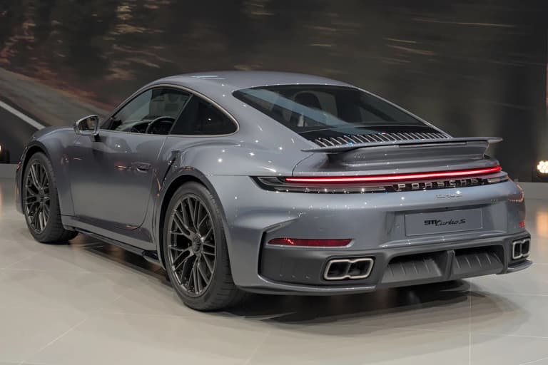 Two Porsche 992 Turbo S coupes at IAA 2025 in Slate Gray