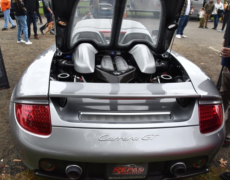 Open engine bay of a Porsche Carrera GT showing the 5.7 liter V10