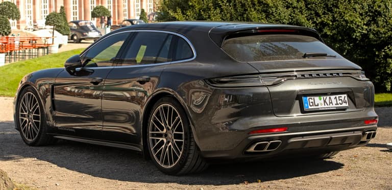 Dark gray second-generation Porsche Panamera Sport Turismo shooting brake rear three-quarter view