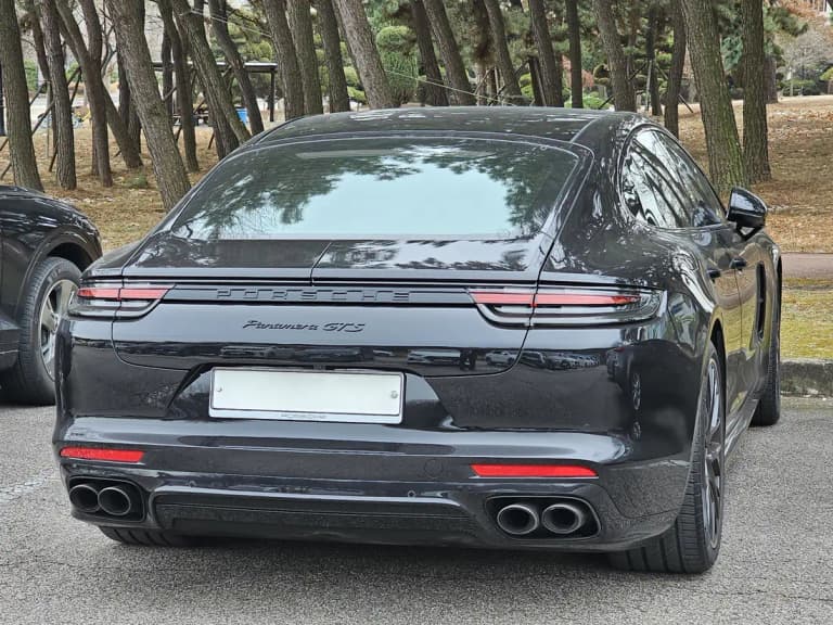 Black Porsche Panamera GTS rear view showing the quad exhaust tips, a model using the 8-speed PDK