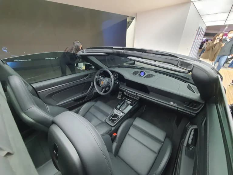 Modern Porsche 992 911 interior with digital instrument cluster and dashboard display
