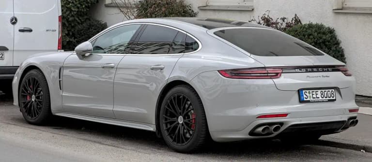 Silver Porsche Panamera Turbo rear three-quarter view