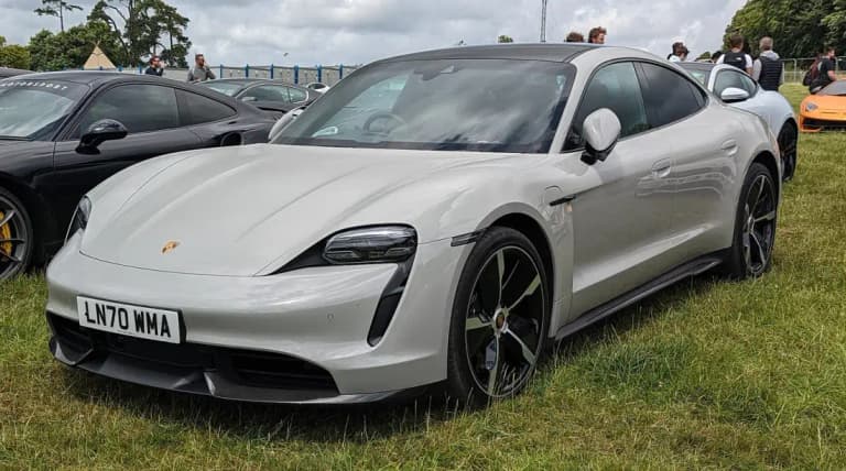 Grey Porsche Taycan Turbo S parked, front three-quarter view