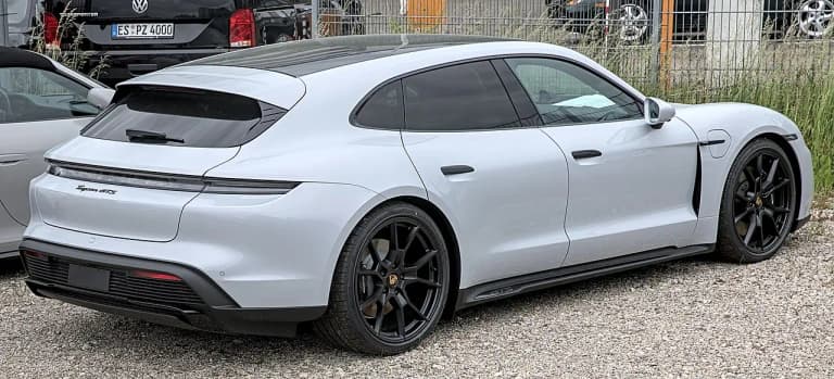 White Porsche Taycan Sport Turismo GTS rear three-quarter view