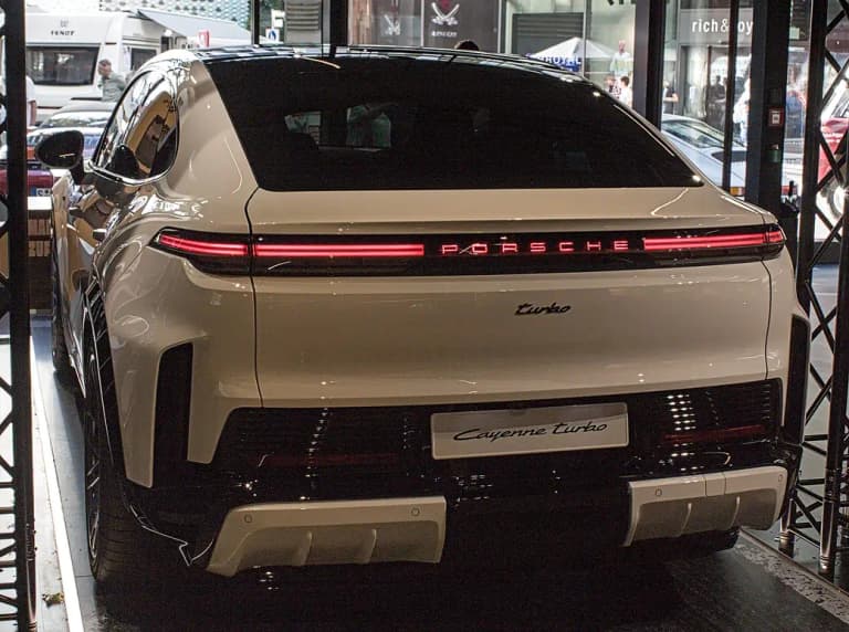 Green Porsche Cayenne Turbo Coupé Electric rear view with sloping coupe roofline