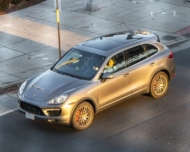 Silver second-generation Porsche Cayenne Turbo (958), front three-quarter view