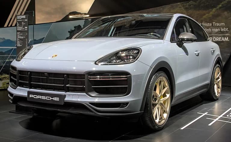 Gray Porsche Cayenne Turbo GT Coupe with bronze wheels, front three-quarter view