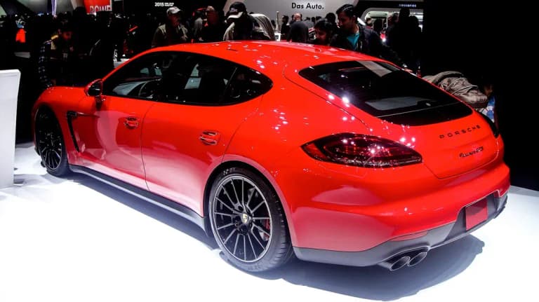 Red facelifted Porsche Panamera GTS 970 rear three-quarter view with black wheels