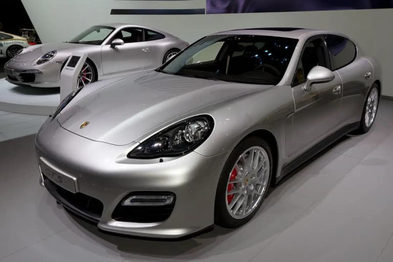Silver first-generation Porsche Panamera GTS on a motor show stand with red brake calipers
