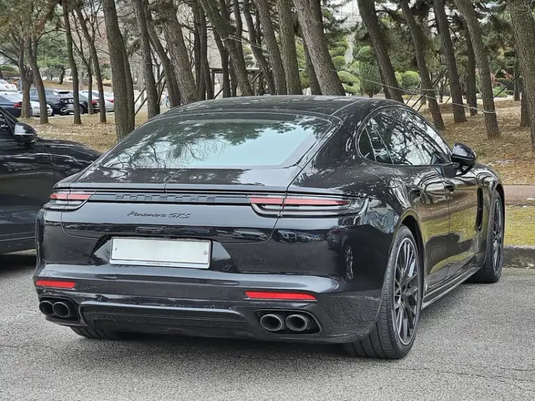 Black Porsche Panamera GTS rear three-quarter view showing the light bar and Panamera GTS badge
