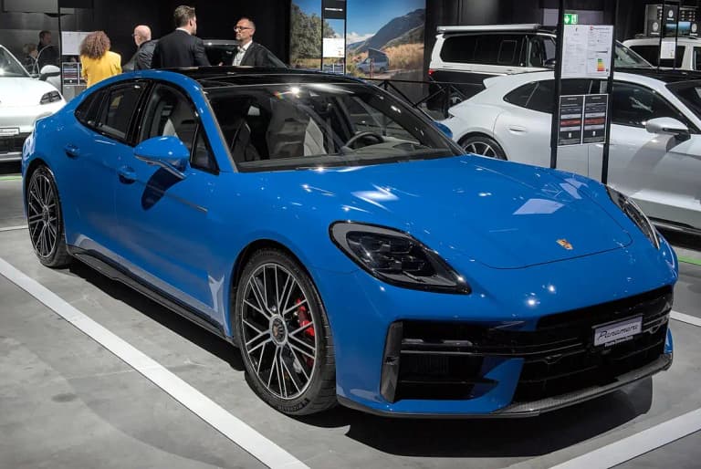 Blue Porsche Panamera GTS, front three-quarter view with carbon front lip and red brake calipers