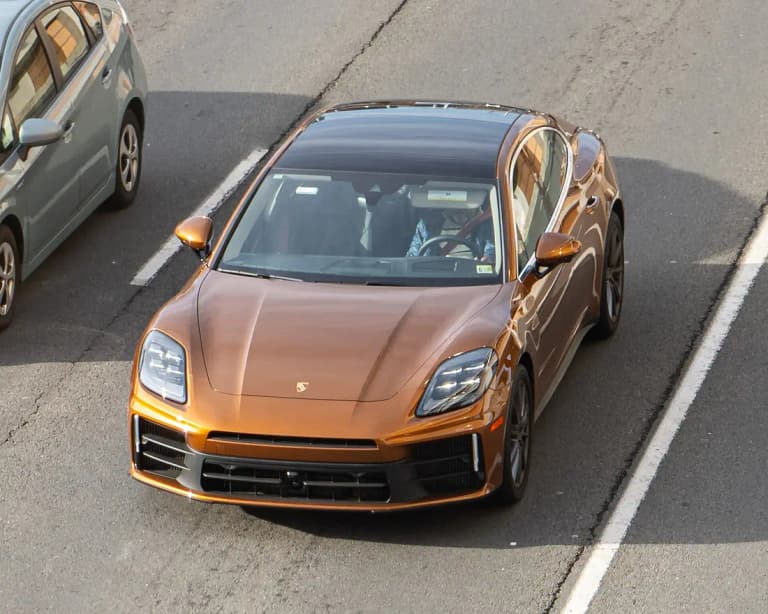 Copper brown third-generation Porsche Panamera 4S seen from above on a road