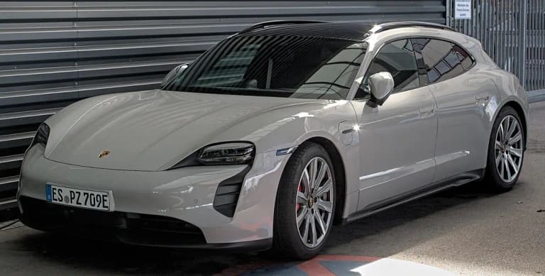 Grey Porsche Taycan GTS Cross Turismo front three-quarter view showing the long roof
