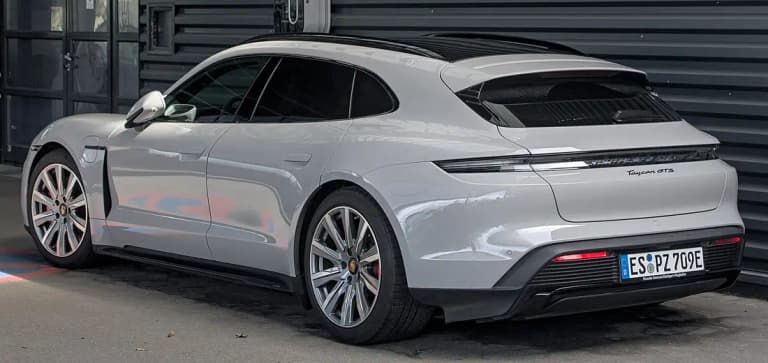 Grey Porsche Taycan GTS Cross Turismo rear three-quarter view showing the extended roofline