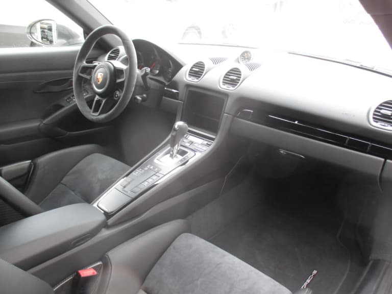 Porsche 718 Cayman T interior with PDK selector, Sport Chrono clock, and Alcantara steering wheel