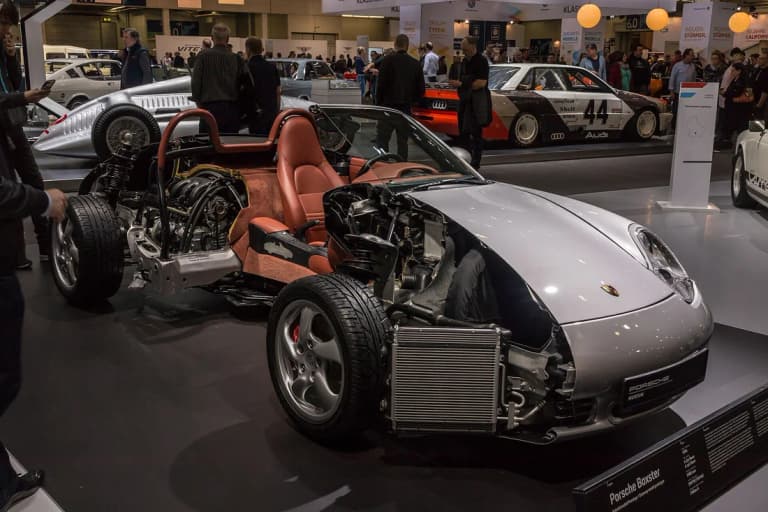 Porsche 986 Boxster museum cutaway showing its mid-engine layout, front cooling hardware, and suspension.