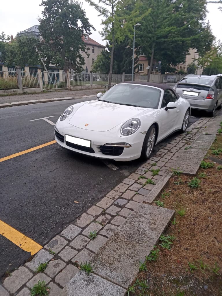 Porsche 991 Carrera 4S Cabriolet with its soft top closed.