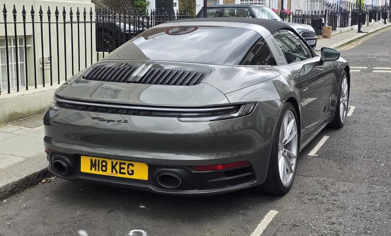 Porsche 992 Targa 4S with its roof bar and rear glass.