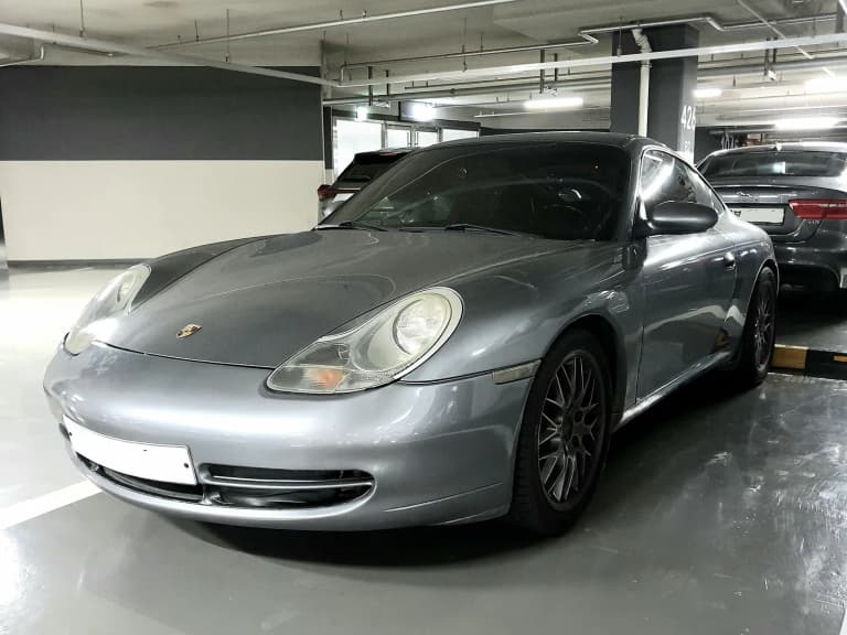 Silver Porsche 996 Carrera 4, a value pick among 911s.
