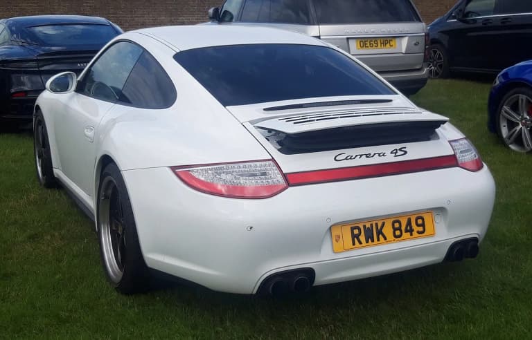 Rear of a 2011 Porsche 997.2 Carrera 4S, which uses the DFI engine without an IMS bearing.