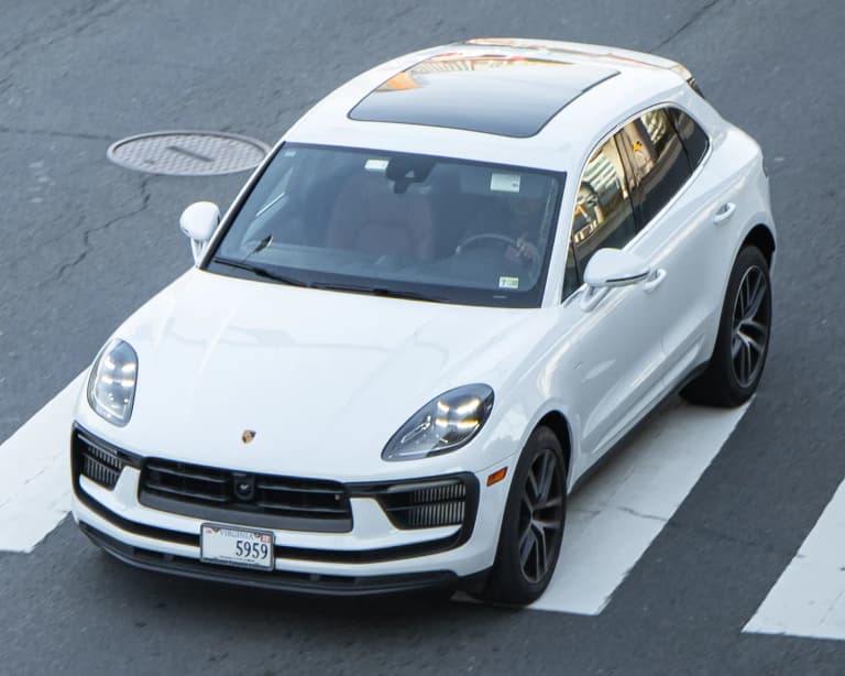 White facelift Porsche Macan S viewed from above at the front three-quarter angle.