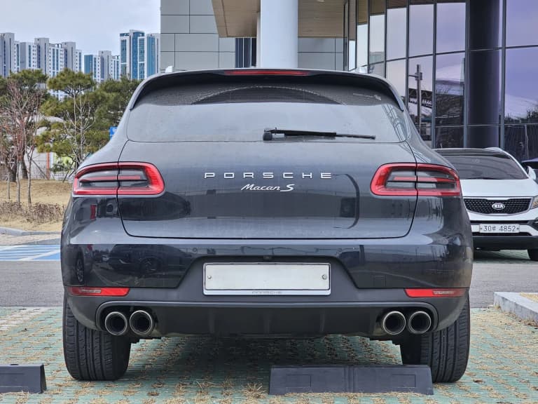 Rear view of a black first-generation Porsche Macan S.