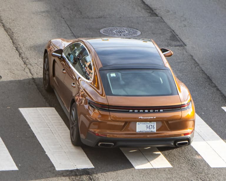 Rear view of a bronze Porsche Panamera 4S 972 in Washington, DC.