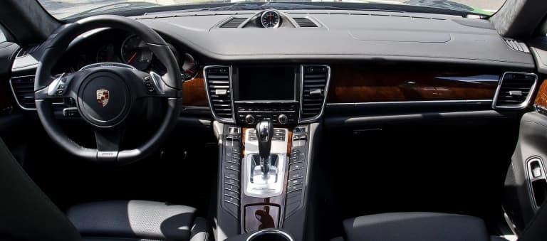 Interior of a first-generation Porsche Panamera Turbo, with its button-covered center console.