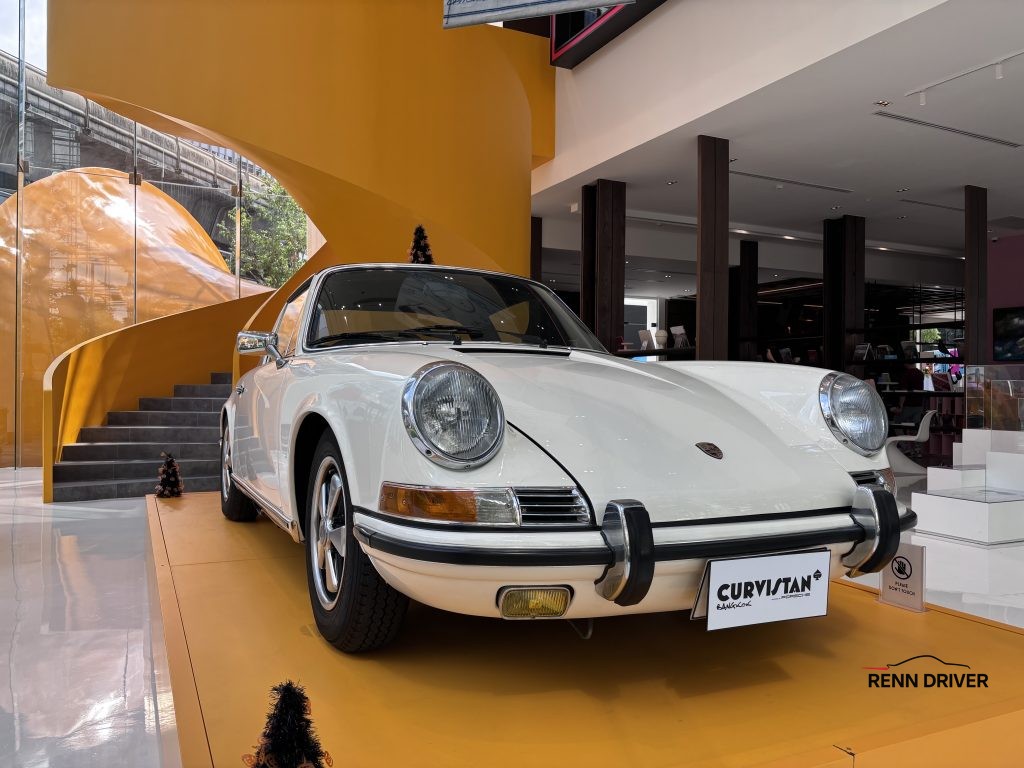 White Porsche 911E in Showroom