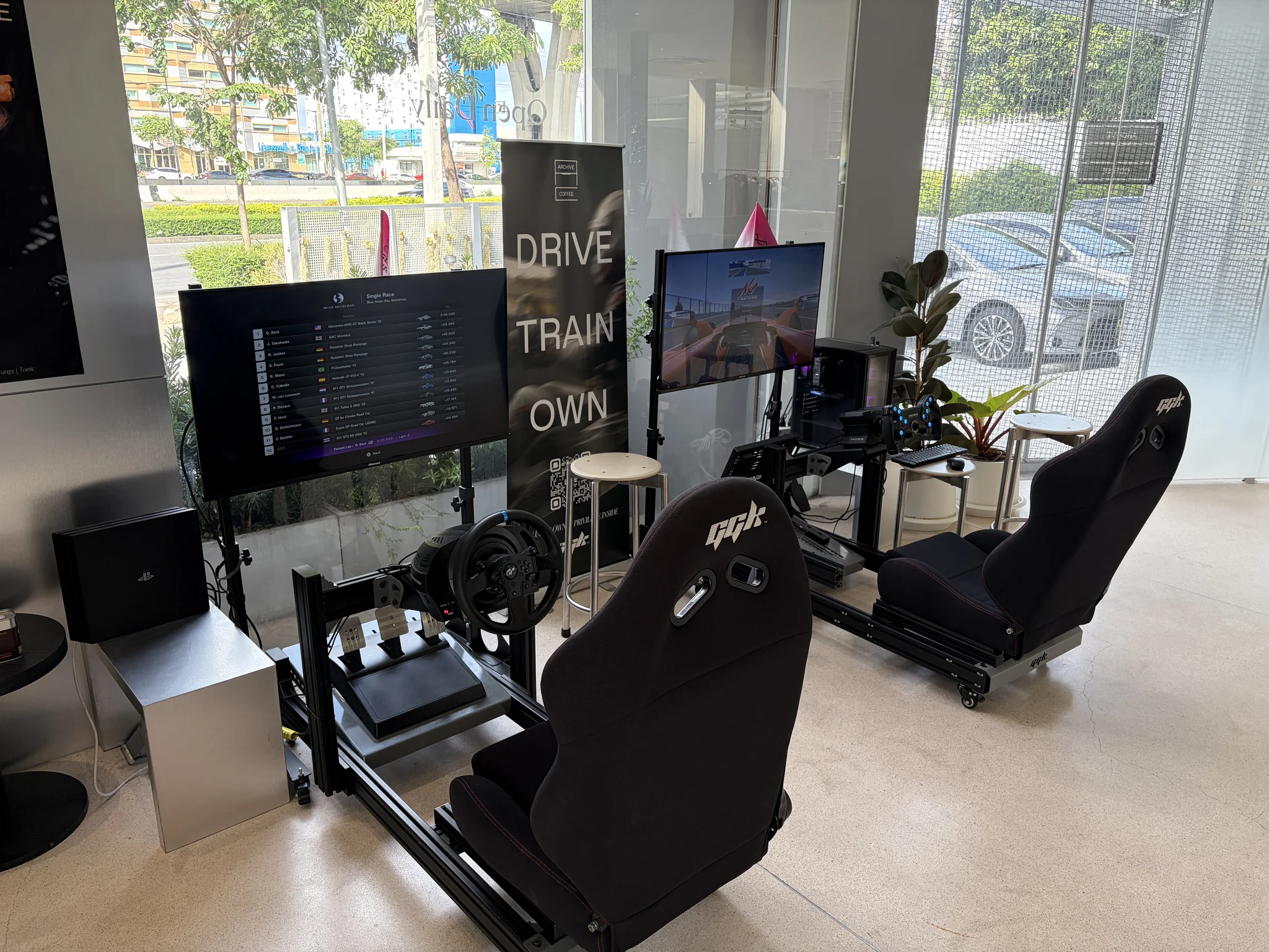 Driving simulator seating area inside Archive Coffee